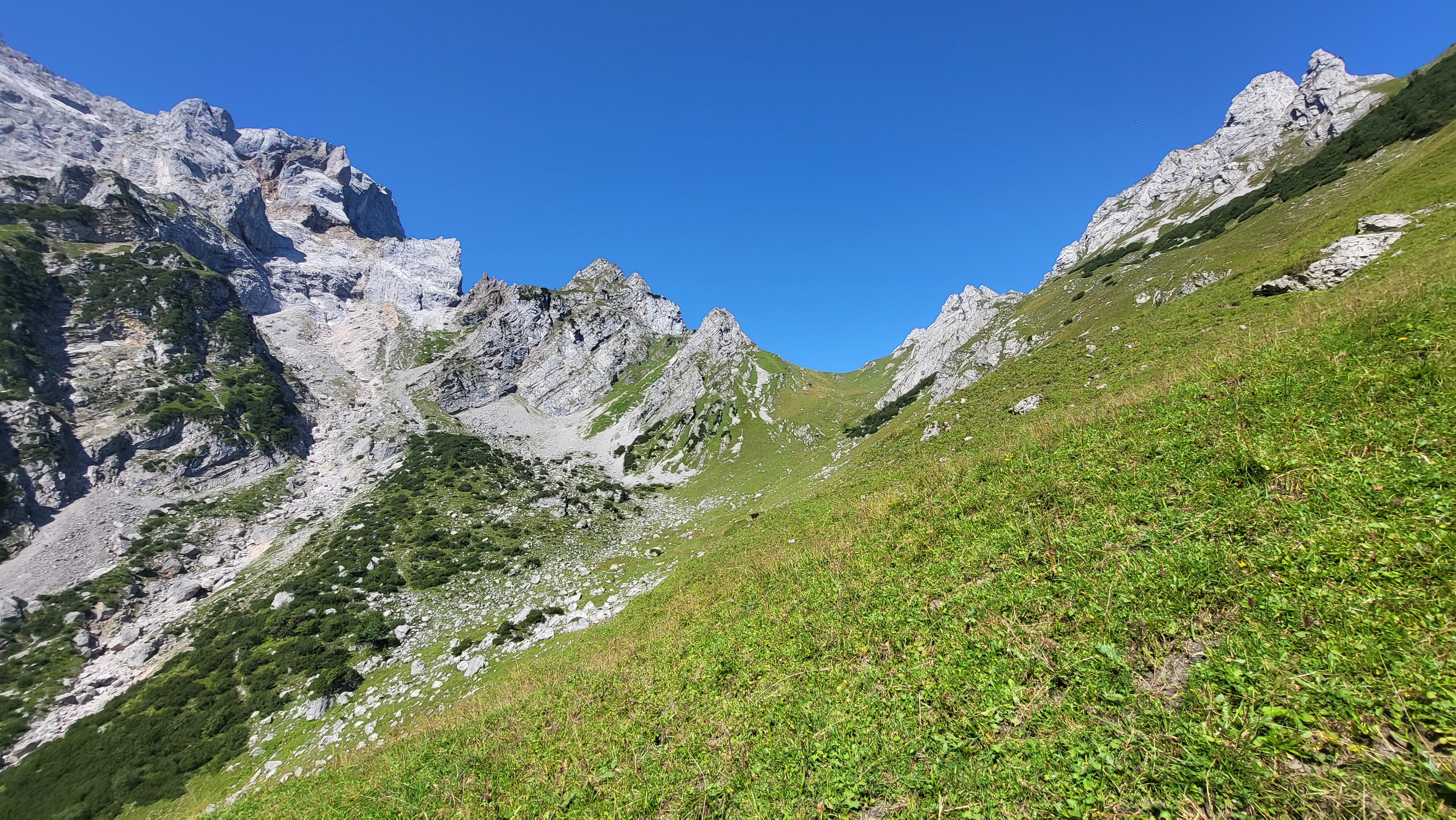 A mountain ridge saddle representing an approaching threshold
